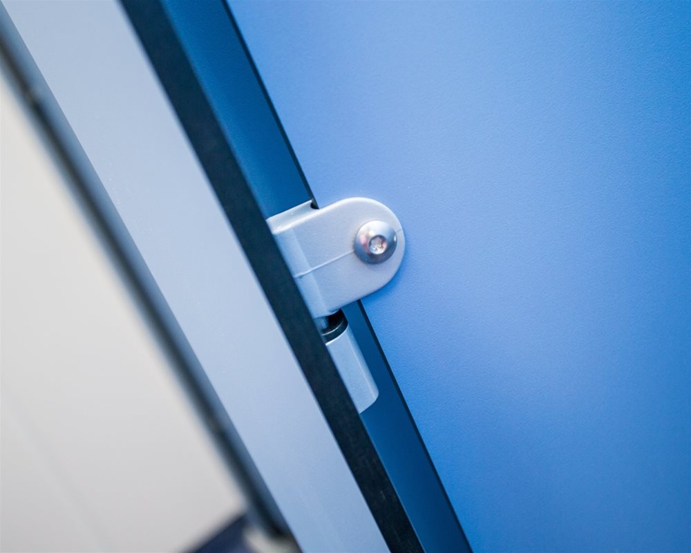 Silver plastic lock body on 'Air Force Blue' toilet cubicle door and 'Pastel Blue' pilaster