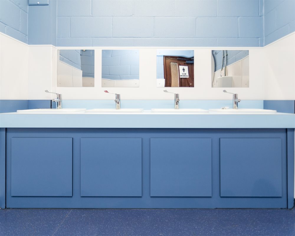 Countertop vanity unit with white washbasins on a 'pastel blue' top and 'air force blue' underframe.