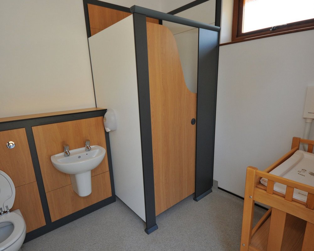 Woodlands Caravan Park family changing room with toilet and shower area.