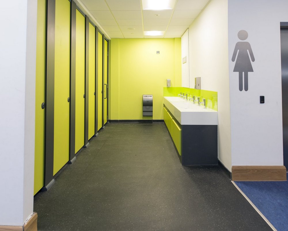 Ysgol Gyfun Ystalyfera washrooms with HiZone cubicle and a solid surface washtrough