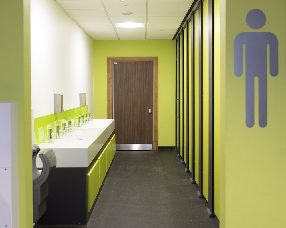 Ysgol Gyfun Ystalyfera male washrooms with HiZone cubicle and a solid surface washtrough