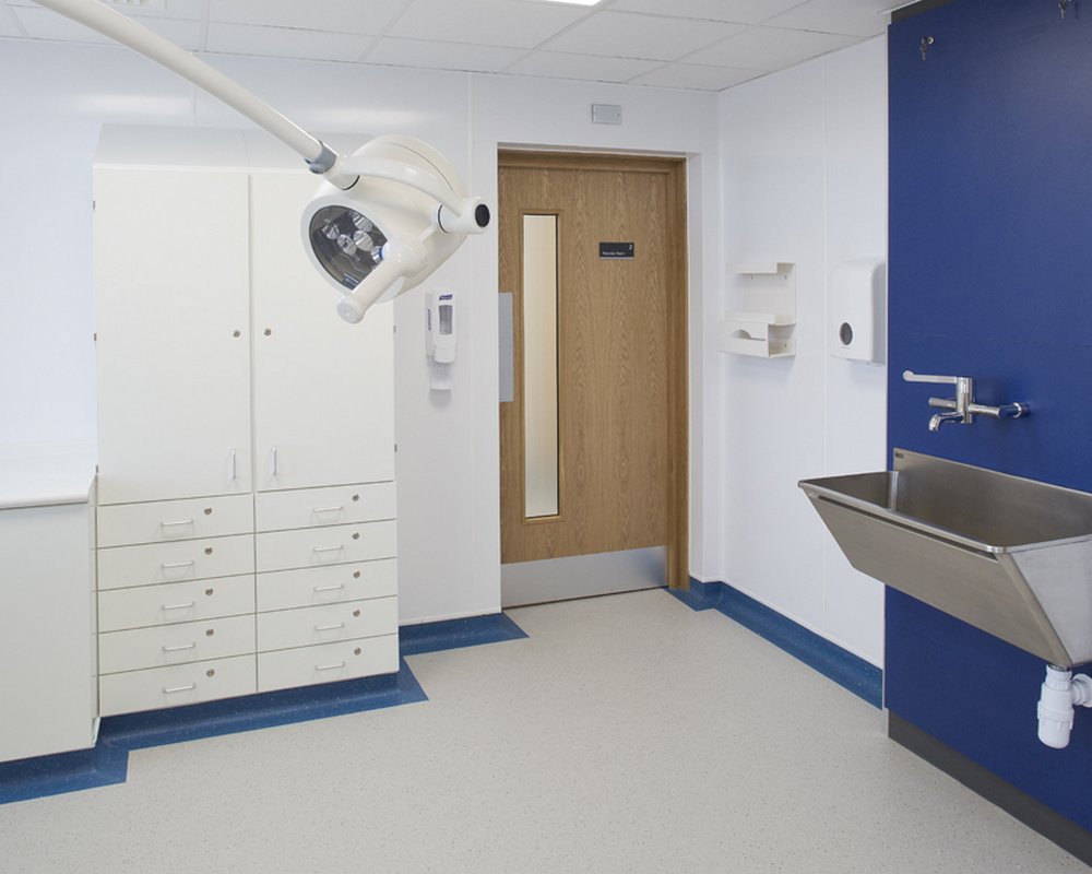 Acre Mills Hospital clinical room with stainless steel scrub up trough.