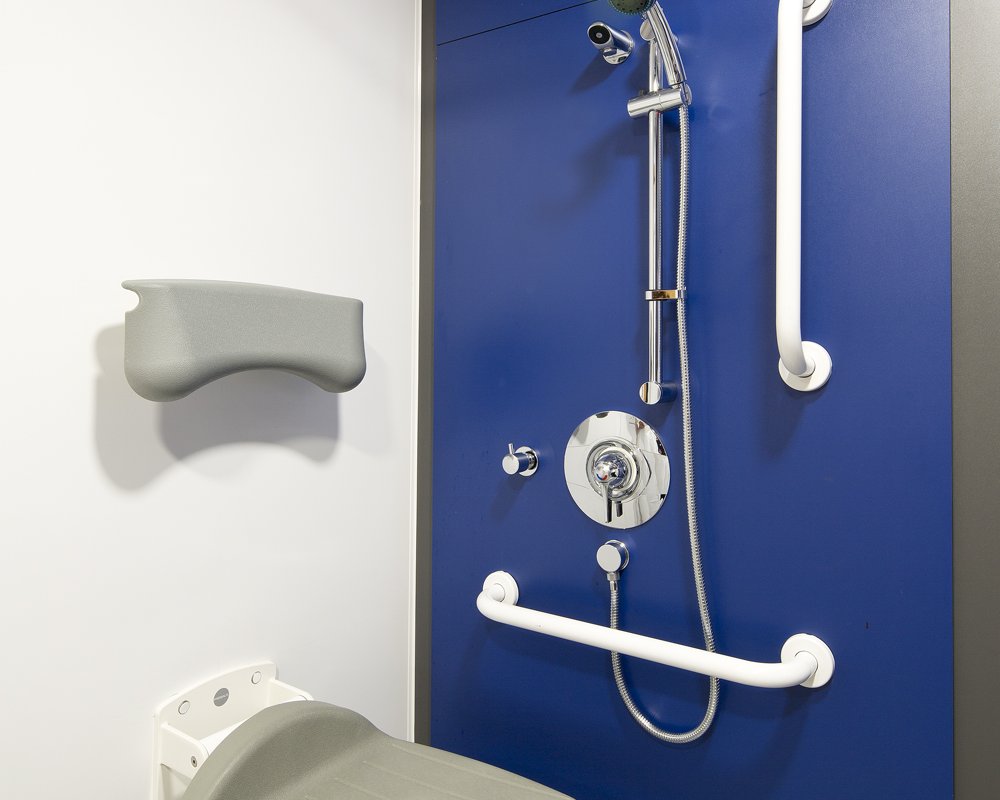 Disabled shower area with blue panels at Acre Mills Hospital