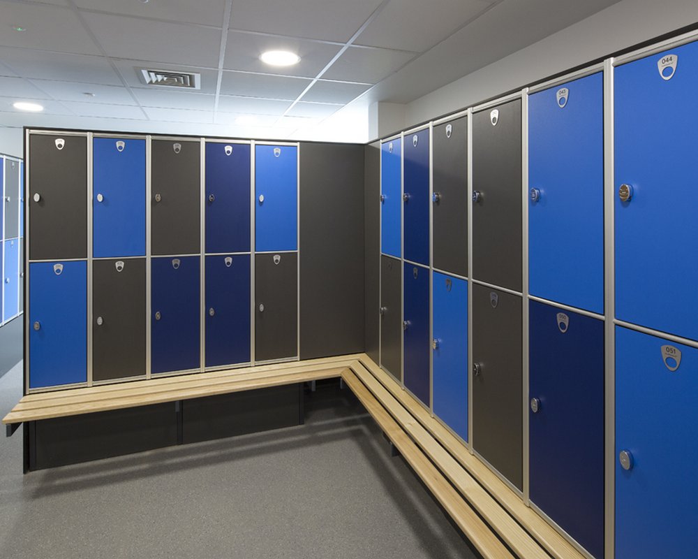 Blue and grey lockers and ash locker benching in staff area at Acre Mills Hospital