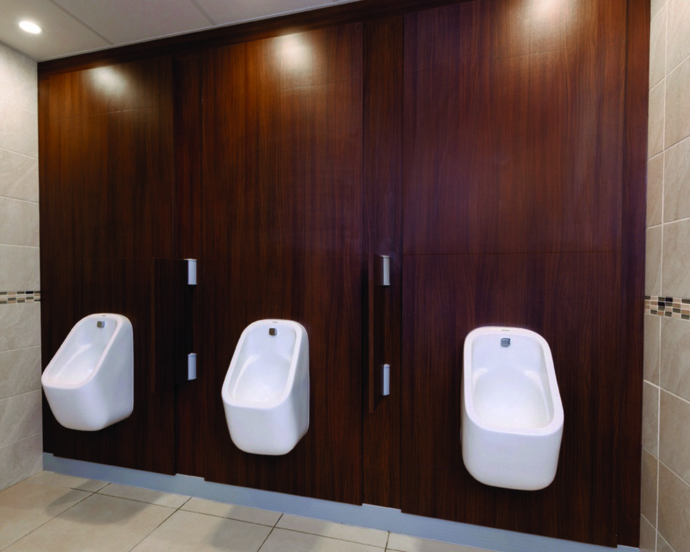 The Church of Scientology urinals pre-plumbed onto American Walnut IPS panels
