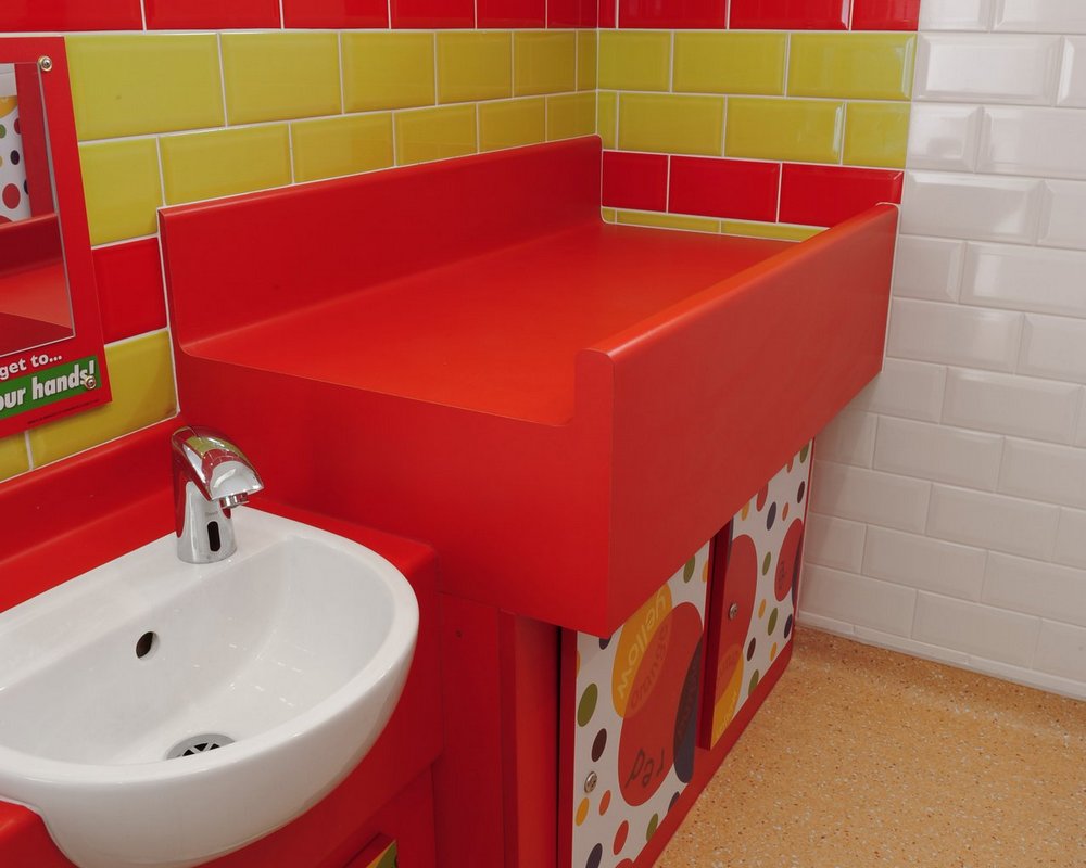 HPL Baby change unit in 'bright red' colour with laminate 'colour creations' under panels