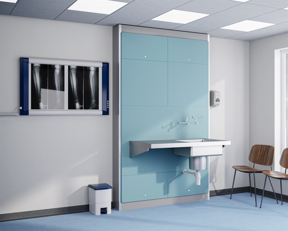 Post formed Traditional Healthcare IPS Boxed Out Unit in High Pressure Laminate with stainless steel Plaster Sink and Drainer and extended lever bib taps, in hospital plaster room scene