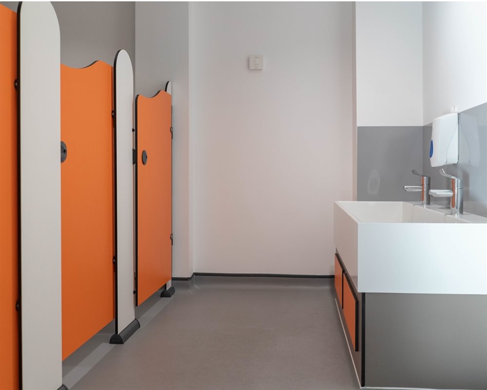 Tiny Stuff toilet cubicles in 'Tangerine' orange and 'Arctic' white for Ystalyfera nursery